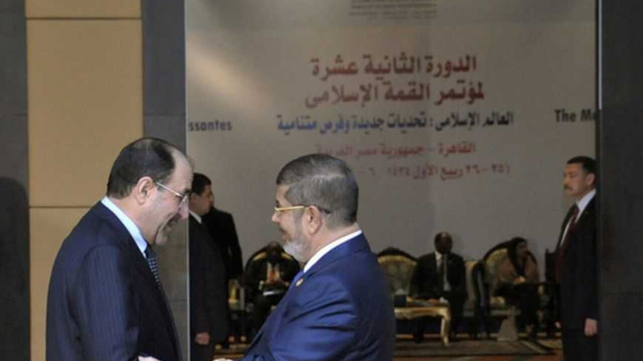 Egyptian President Mohamed Mursi greets Iraq's Prime Minister Nouri al-Maliki before the opening of the Organisation of Islamic Cooperation (OIC) summit in Cairo Egyptian President Mohamed Mursi (R) greets Iraq's Prime Minister Nouri al-Maliki before the opening of the Organisation of Islamic Cooperation (OIC) summit in Cairo February 6, 2013. Leaders of Islamic nations called for a negotiated end to Syria's civil war at a summit in Cairo that began on Wednesday, thrusting Egypt's new Islamist president to centre stage amid political and economic turbulence at home. REUTERS/Egyptian Presidency/Handout (EGYPT - Tags: POLITICS) ATTENTION EDITORS - THIS IMAGE WAS PROVI