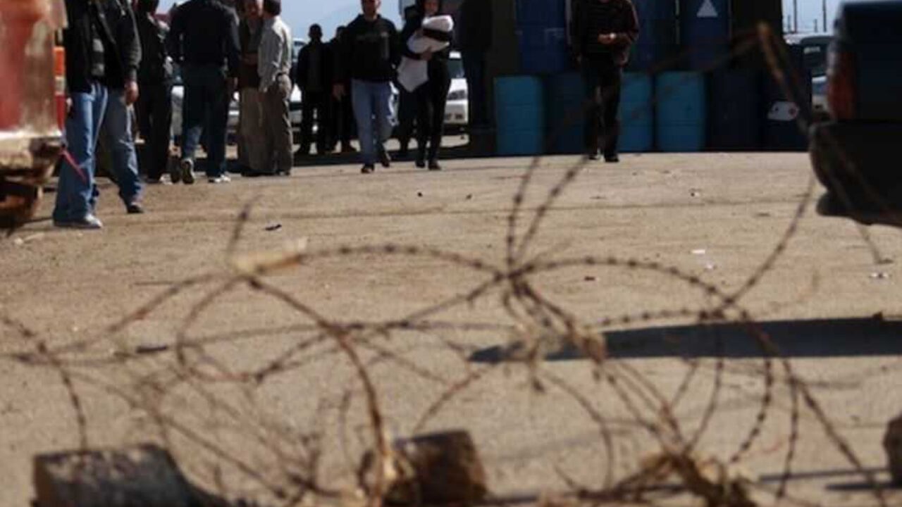 People cross the Lebanese-Syrian border by foot in northern Lebanon People cross the Lebanese-Syrian border by foot after residents blocked the road in protest against what they said were the sending of diesel to the Syrian goverment, in northern Lebanon February 13, 2013. REUTERS/Omar Ibrahim (LEBANON - Tags: POLITICS CIVIL UNREST) - RTR3DQO6