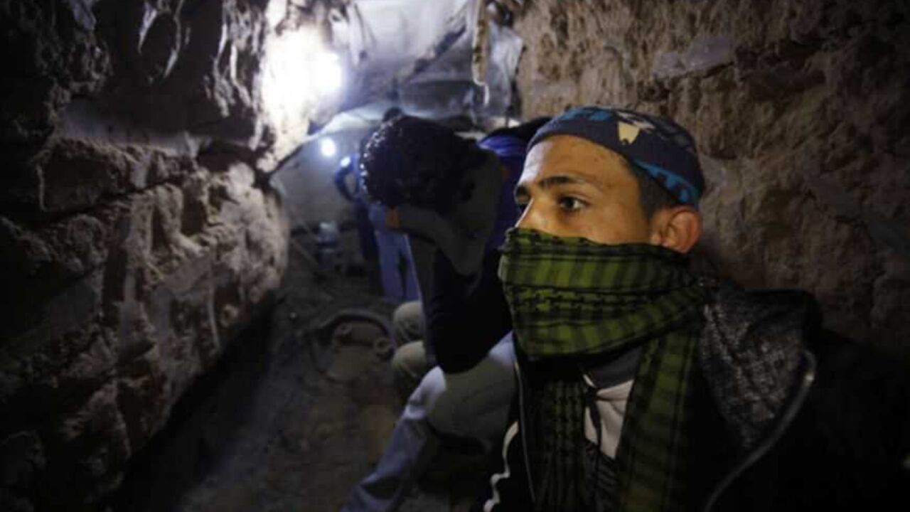 Palestinian works inside smuggling tunnel in the southern Gaza Strip A Palestinian works inside a smuggling tunnel flooded by Egyptian forces, beneath the Egyptian-Gaza border in Rafah, in the southern Gaza Strip February 19, 2013. Egypt will not tolerate a two-way flow of smuggled arms with the Gaza Strip that is destabilising its Sinai peninsula, a senior aide to its Islamist president said, explaining why Egyptian forces flooded sub-border tunnels last week. To match Interview PALESTINIANS-TUNNELS/EGYPT REUTERS/Ibraheem Abu Mustafa (GAZA - Tags: POLITICS CIVIL UNREST) - R