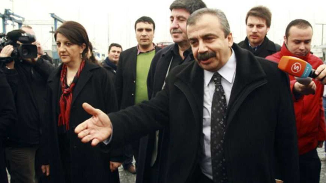 Pro-Kurdish politicians Onder, Buldan and Tan, are surrounded by media members before leaving for Imrali island in Istanbul Pro-Kurdish politicians Sirri Sureyya Onder (R), Pelvin Buldan (L) and Altan Tan (C), are surrounded by media members before leaving for Imrali island in Istanbul February 23, 2013. A delegation of pro-Kurdish politicians left for Imrali island to meet with imprisoned Kurdistan Workers Party (PKK) leader Abdullah Ocalan. Turkey launched tentative negotiations with PKK leader Ocalan in his jail on Imrali island near Istanbul in October, drawing up a framework to end a conflict which has killed more than 40,0
