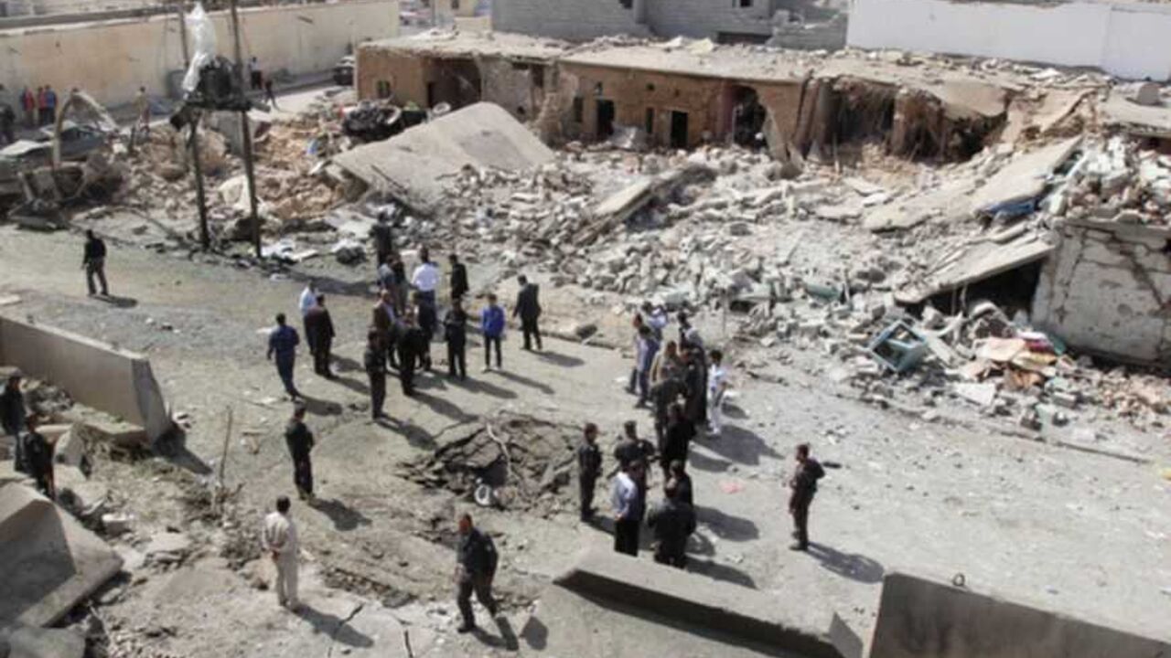 Security personnel and residents gather around a crater caused by a suicide car bomb attack in Debis Security personnel and residents gather around a crater caused by a suicide car bomb attack in Debis, west of Kirkuk March 11, 2013. Three civilians were killed and some 70 others were wounded when a suicide car bomb went off on Monday, west of the ethnically mixed northern Iraqi city of Kirkuk, police and hospital sources said. A large number of school pupils were wounded in the attack, which reduced a number of houses to rubble and damaged about ten cars. REUTERS/Ako Rasheed (IRAQ - Tags: CIVIL UNREST P