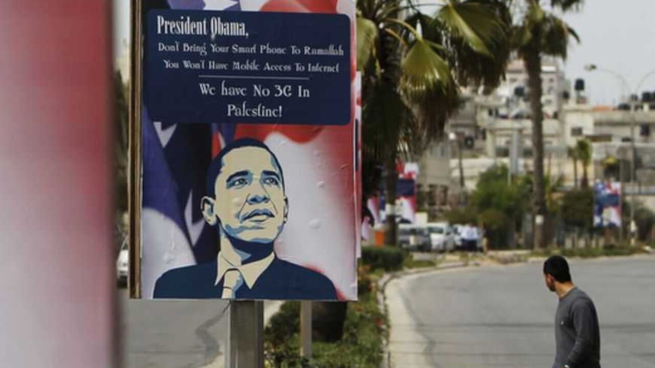A Palestinian man walks near placards designed by an activist depicting U.S. President Obama, ahead of his visit to the region, in Ramallah A Palestinian man walks near placards designed by an activist depicting U.S. President Barack Obama, ahead of his visit to the region, in the West Bank city of Ramallah March 12, 2013. The White House has yet to officially announce the dates for the trip, but Israeli news media have reported that Obama will arrive in the region on March 20. REUTERS/Ammar Awad (WEST BANK - Tags: POLITICS) - RTR3EVUU