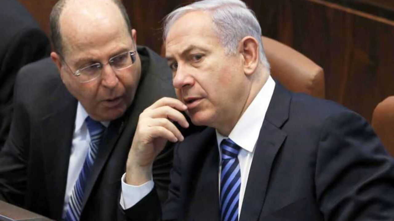 Israel's Prime Minister Netanyahu and Defence Minister Yaalon speak during the swearing-in ceremony, at Israeli Parliament, in Jerusalem Israel's Prime Minister Benjamin Netanyahu (3rd L) and Defence Minister Moshe Yaalon (2nd L) speak during the swearing-in ceremony, at the Knesset, the Israeli Parliament, in Jerusalem March 18, 2013. Netanyahu's new governing coalition took office after a parliamentary vote on Monday with powerful roles reserved for supporters of settlers in occupied territory. REUTERS/Baz Ratner (JERUSALEM - Tags: POLITICS) - RTR3F5XR
