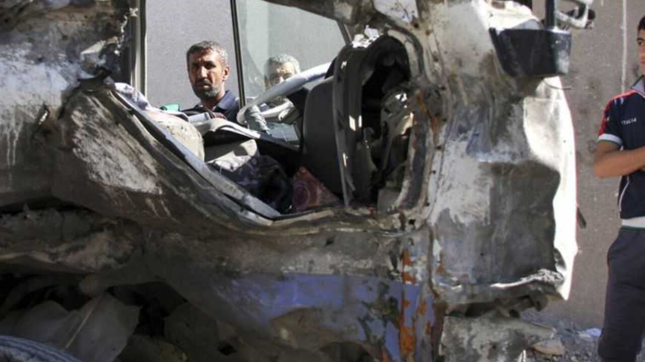Residents gather at the site of a car bomb attack in Baghdad's Sadr City Residents gather at the site of a car bomb attack in Baghdad's Sadr City,March 19, 2013. A dozen car bombs and suicide blasts tore into Shi'ite districts in Baghdad and south of the Iraqi capital on Tuesday, killing more than 50 people on the 10th anniversary of the U.S.-led invasion that ousted Saddam Hussein. REUTERS/Wissm al-Okili (IRAQ - Tags: CONFLICT CIVIL UNREST) - RTR3F6NC