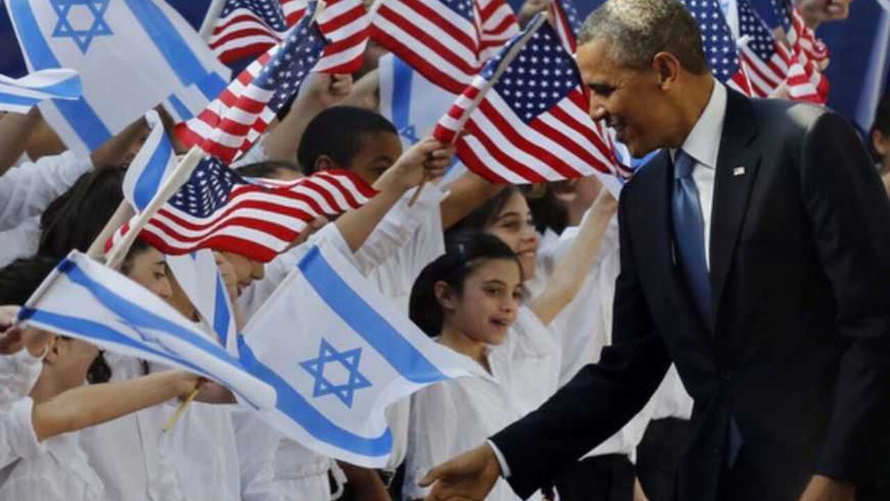 U.S. President Barack Obama shakes hands with children before he signs a guest book at the residence of Israel's President Shimon Peres in Jerusalem U.S. President Barack Obama shakes hands with children before he signs a guest book at the residence of Israel's President Shimon Peres in Jerusalem, March 20, 2013. Making his first official visit to Israel, U.S. President Barack Obama pledged on Wednesday unwavering commitment to the security of the Jewish State where concern over a nuclear-armed Iran has clouded U.S.-Israeli relations. REUTERS/Larry Downing (JERUSALEM - Tags: POLITICS) - RTR3F8AE