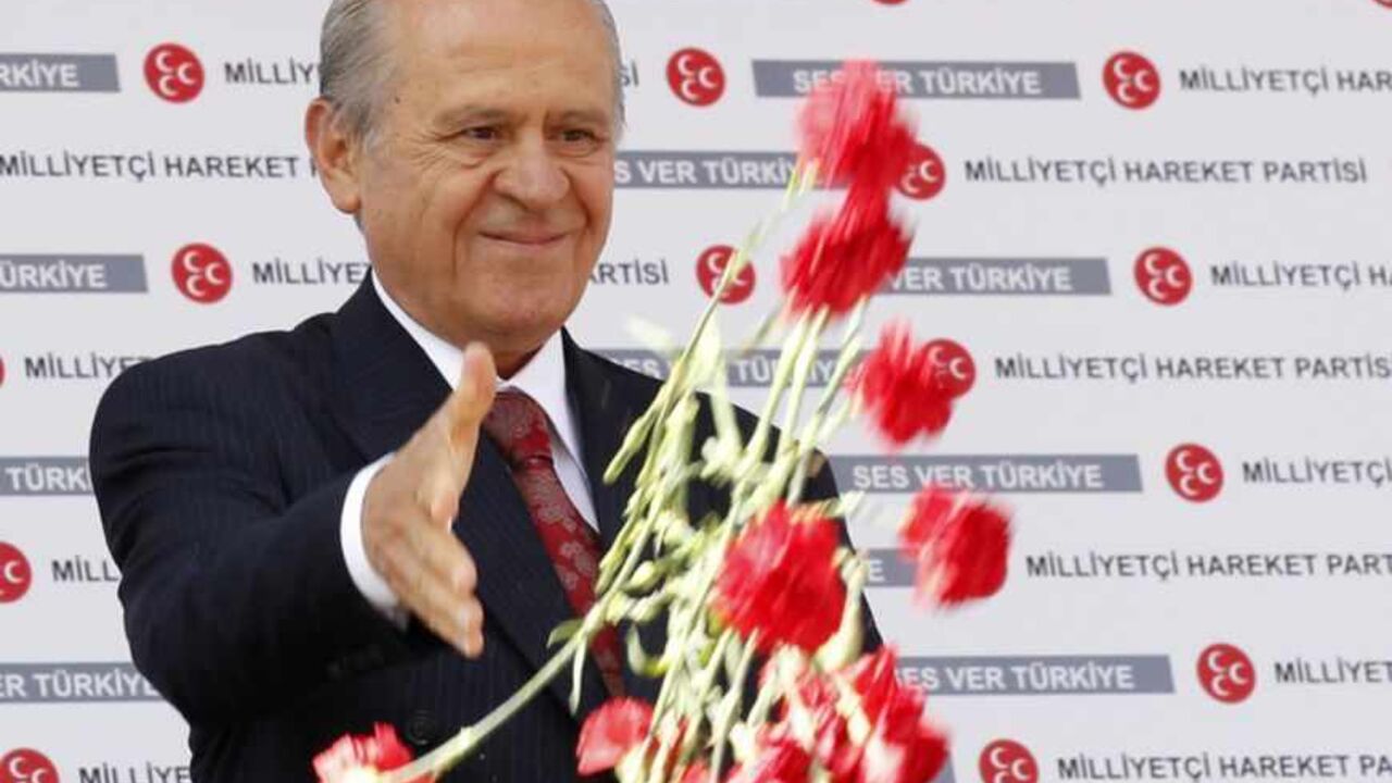 MHP leader Devlet Bahceli hands out carnations during an election rally in Ankara Nationalist Movement Party (MHP) leader Devlet Bahceli hands out carnations during an election rally in Ankara June 4, 2011. Turkey will hold parliamentary elections on June 12. REUTERS/Umit Bektas (TURKEY - Tags: ELECTIONS POLITICS) - RTR2NA75
