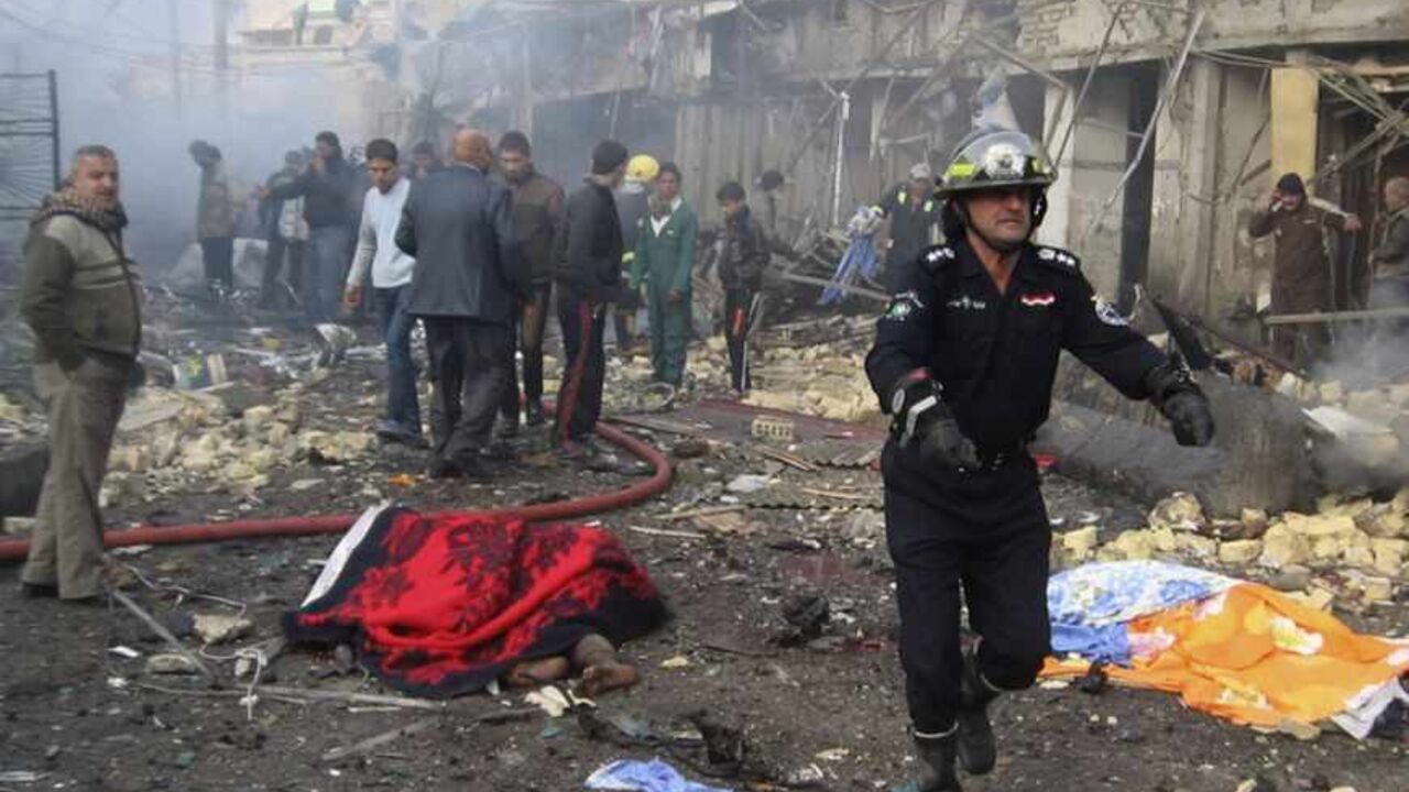 Iraqi civil defence personnel and people gather at the site of a bomb attack in Baghdad's northwestern Kadhimiya district Iraqi civil defence personnel and people gather at the site of a bomb attack in Baghdad's northwestern Kadhimiya district January 5, 2012. A set of explosions involving two car bombs in Kadhimiya killed at least 15 people and wounded 32, police and hospital sources said. Bomb attacks targeting Shi'ite Muslim areas of Iraq killed at least 67 people on Thursday, police and hospital sources said, ramping up fears of an increase in sectarian strife. REUTERS/Stringer (IRAQ - Tags: CONFLICT CIVIL UNREST CRIME LA