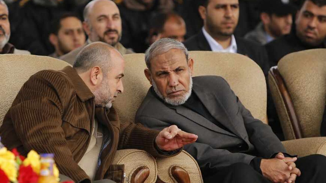 Head of Hamas security services Abu Sharekh speaks with senior Hamas leader Al-Zahar during a graduation ceremony for members of Hamas security forces in Gaza City Head of Hamas security services Salah Abu Sharekh (L) speaks with senior Hamas leader Mahmoud Al-Zahar (R) during a graduation ceremony for members of Hamas security forces in Gaza City January 2, 2013. REUTERS/Suhaib Salem (GAZA - Tags: POLITICS) - RTR3C1N7