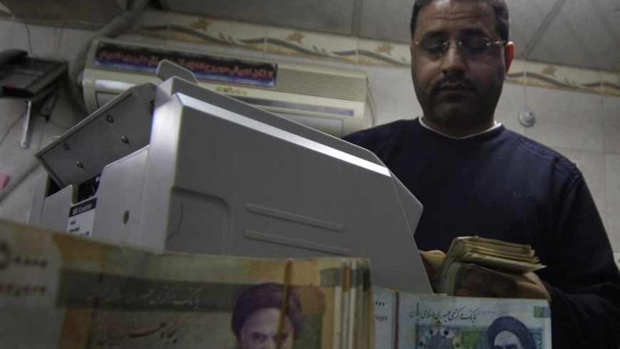 A man counts stacks of Iranian rials at a currency exchange shop in Kerbala A man counts stacks of Iranian rials at a currency exchange shop in Kerbala , 110 km (70 miles) south of Baghdad January 23, 2013. Traders and owners of hotels in the holy city of Kerbala complain of sluggish business and a drop in Iranian pilgrims as a result of a sharp fall in the Iranian rial caused by a package of international sanctions imposed on the neighbouring country. REUTERS/Mushtaq Muhammed (IRAQ - Tags: SOCIETY BUSINESS) - RTR3CUEH