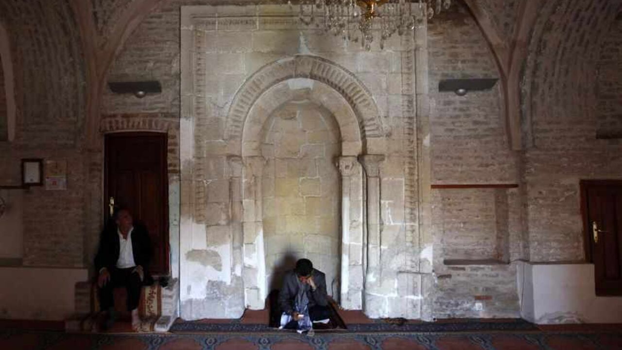 A man reads Koran as another listens in a mosque in town of Cizre in Sirnak province A man reads a Koran as another listens in a mosque in the town of Cizre in Sirnak province, near the border with Syria March 22, 2013. Turkey's fledgling peace process with the Kurdistan Workers Party (PKK) militant group is all over the headlines. After three decades of war, 40,000 deaths and a devastating impact on the local economy, everybody seems ready for peace. Pro-Kurdish politicians are focused on boosting minority rights and stronger local government for the Kurds, who make up about 20 percent of