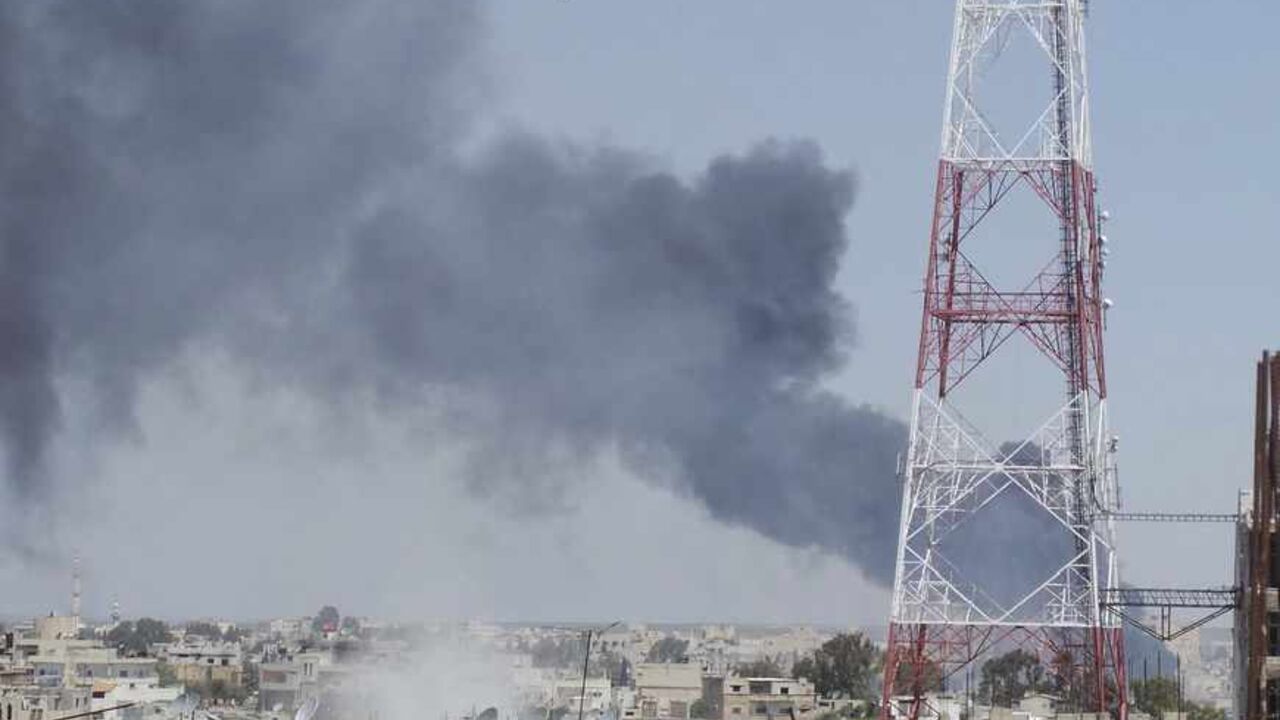 Smoke rises after what activists said was a missile fired by a Syrian Air Force fighter jet loyal to President Bashar al-Assad in Deraa, April 26, 2013. REUTERS/Mazen Abu Mahmoud/Shaam News Network/Handout (SYRIA - Tags: POLITICS CIVIL UNREST) ATTENTION EDITORS - THIS PICTURE WAS PROVIDED BY A THIRD PARTY. REUTERS IS UNABLE TO INDEPENDENTLY VERIFY THE AUTHENTICITY, CONTENT, LOCATION OR DATE OF THIS IMAGE. FOR EDITORIAL USE ONLY. NOT FOR SALE FOR MARKETING OR ADVERTISING CAMPAIGNS. THIS PICTURE IS DISTRIBUTE