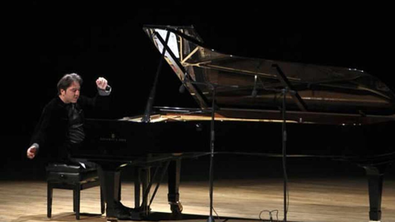 TURKEY/ Turkish classical pianist Fazil Say performs during a concert in Ankara October 14, 2010. Internationally acclaimed Turkish classical pianist Fazil Say goes on trial on charges of insulting Muslim religious values in comments he posted on Twitter. REUTERS/Stringer (TURKEY - Tags: POLITICS CIVIL UNREST SOCIETY) - RTR399ZY