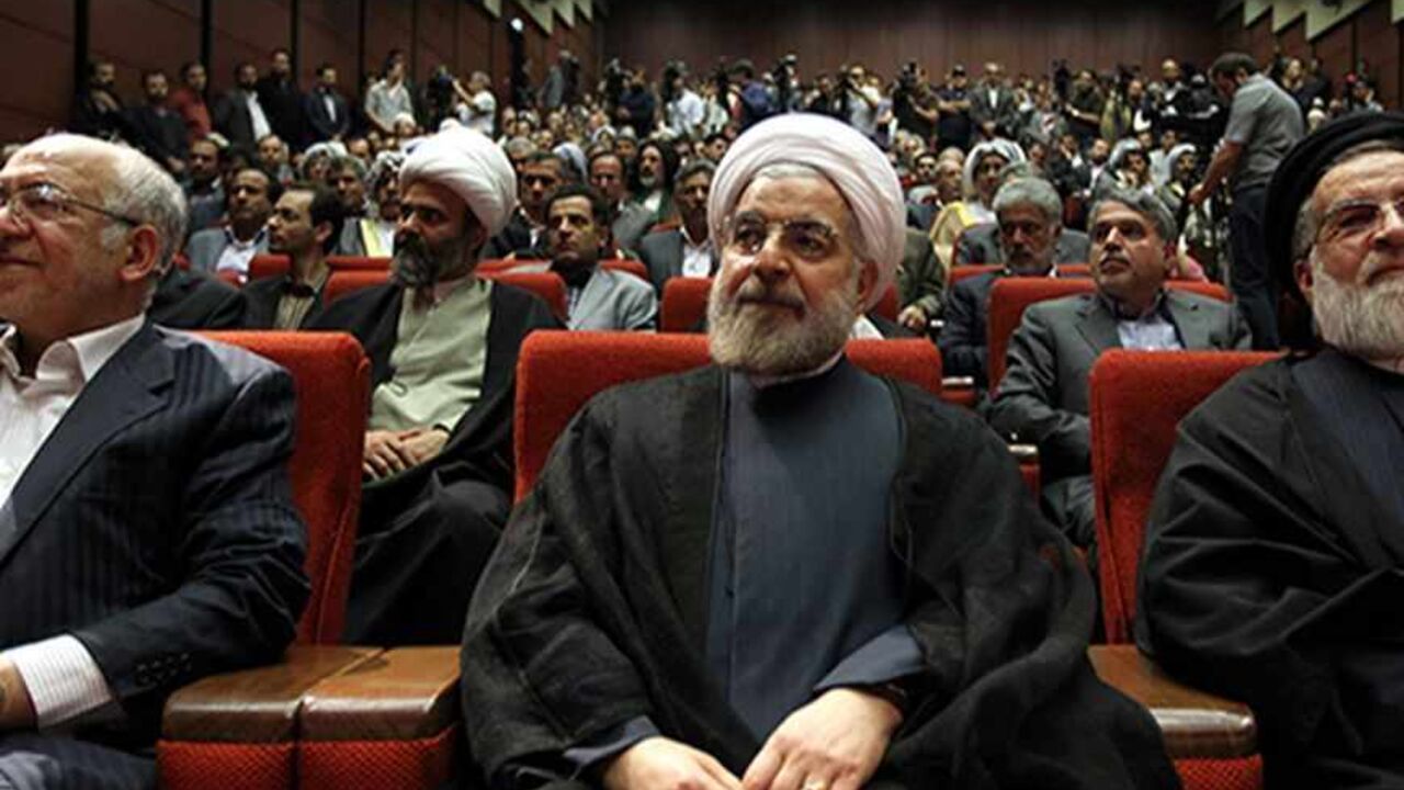 Nic6208109 Iran's former top nuclear negotiator Hassan Rowhani (C) attends a ceremony where he announced his candidacy for the upcoming presidential election in Tehran on April 11, 2013. The June 14 election will be followed closely four years after Mahmoud Ahmadinejad's re-election for a second term sparked a wave of violent protests that were suppressed by the regime with deadly force. AFP PHOTO/ATTA KENARE (Photo credit should read ATTA KENARE/AFP/Getty Images)