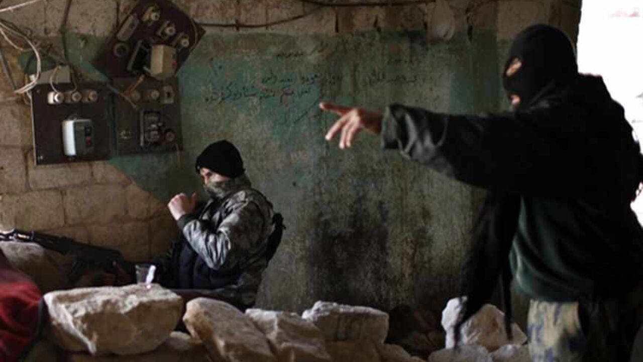 SYRIA-CRISIS/ Fighters from Islamist Syrian rebel group Jabhat al-Nusra take their positions on the front line during a clash with Syrian forces loyal to President Bashar al Assad in Aleppo December 24, 2012. Syria special envoy Lakhdar Brahimi discussed solving the country's conflict with President Bashar al-Assad on Monday, but the opposition expressed deepening frustration with the mission following what it called the latest massacre of civilians. REUTERS/Ahmed Jadallah (SYRIA - Tags: CIVIL UNREST POLITICS) - RTR3BVVN