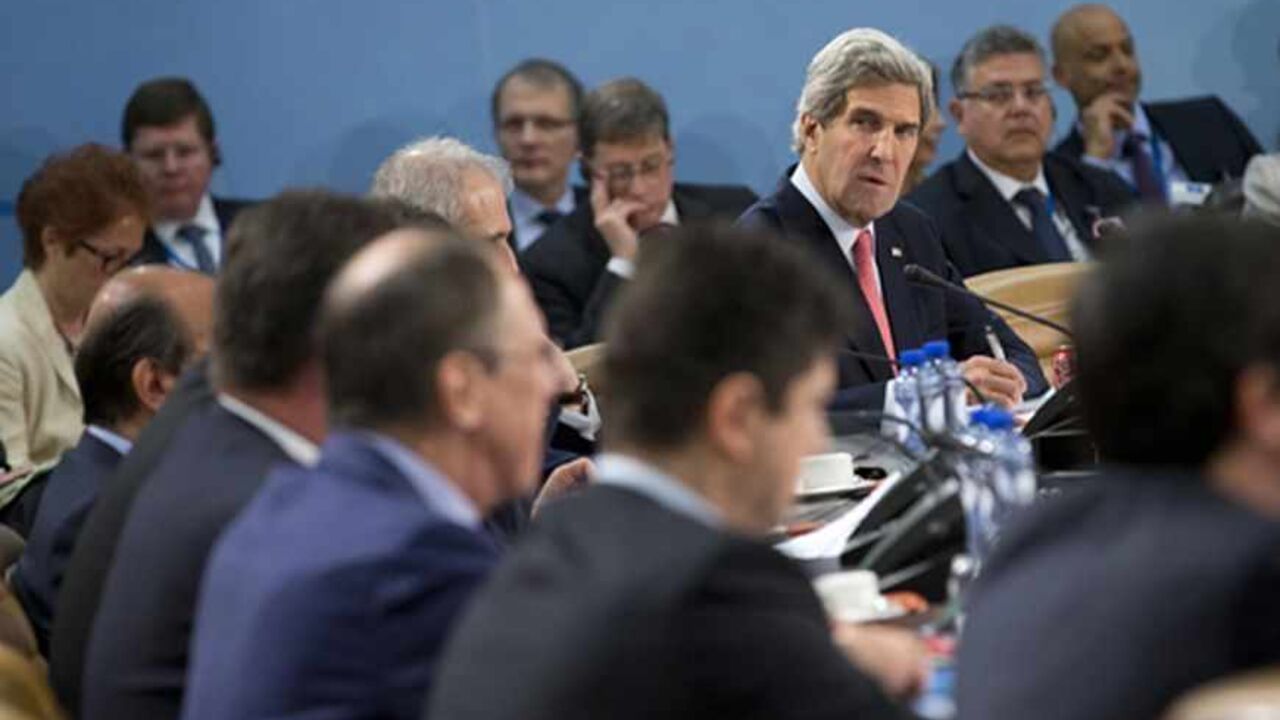 NATO/ U.S. Secretary of State John Kerry looks towards Russian Foreign Minister Sergei Lavrov before the start of the NATO- Russia Council meeting at NATO headquarters in Brussels April 23, 2013. REUTERS/Evan Vucci/Pool (BELGIUM - Tags: POLITICS) - RTXYWOB