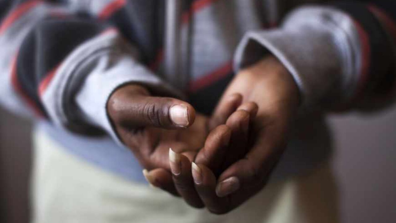 To match feature ISRAEL-MIGRANTS/ Hrity, a migrant from Eritrea, holds her hands as she poses for a photograph in the central city of Lod, near Tel Aviv April 9, 2012. Some 60,000 African migrants fleeing authoritarian rule in Eritrea and fighting in neighbouring Sudan and what is now South Sudan have crossed illegally into Israel across the relatively porous desert border with Egypt. Picture taken April 9, 2012. To match feature ISRAEL-MIGRANTS/ REUTERS/Nir Elias (ISRAEL - Tags: SOCIETY IMMIGRATION POLITICS) - RTR30ZEI