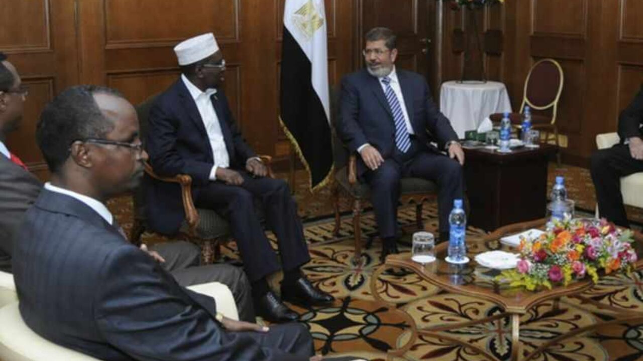 Egypt's President Mursi meets with Somalia's President Ahmed during the AU leaders' meeting in Addis Ababa Egypt's President Mohamed Mursi (2nd R) meets with Somalia's President Sheikh Sharif Ahmed (3rd R) during the African Union (AU) leaders' meeting in Addis Ababa July 16, 2012. REUTERS/Mohamed Abd El Mouty/Egyptian Presidency/Handout (ETHIOPIA - Tags: POLITICS) FOR EDITORIAL USE ONLY. NOT FOR SALE FOR MARKETING OR ADVERTISING CAMPAIGNS. THIS IMAGE HAS BEEN SUPPLIED BY A THIRD PARTY. IT IS DISTRIBUTED, EXACTLY AS RECEIVED BY REUTERS, AS A SERVICE TO CLIENTS - RTR34ZTB