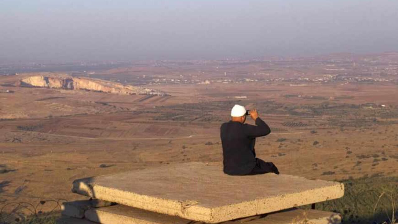 A Druze man uses binoculars as he looks towards Syria from part of an abandoned military outpost in the Golan Heights A Druze man uses binoculars as he looks towards Syria from part of an abandoned military outpost near the Druze village of Buqata in the Golan Heights July 24, 2012. The Syrian government is still in full control of its chemical weapons stockpiles, Israeli defence officials said on Tuesday, in an apparent bid to calm fears that a non-conventional war could be looming. Israel captured the Golan Heights in the 1967 Middle East war and annexed it in 1981 in a move not recognized internationally. REUTERS/Ronen