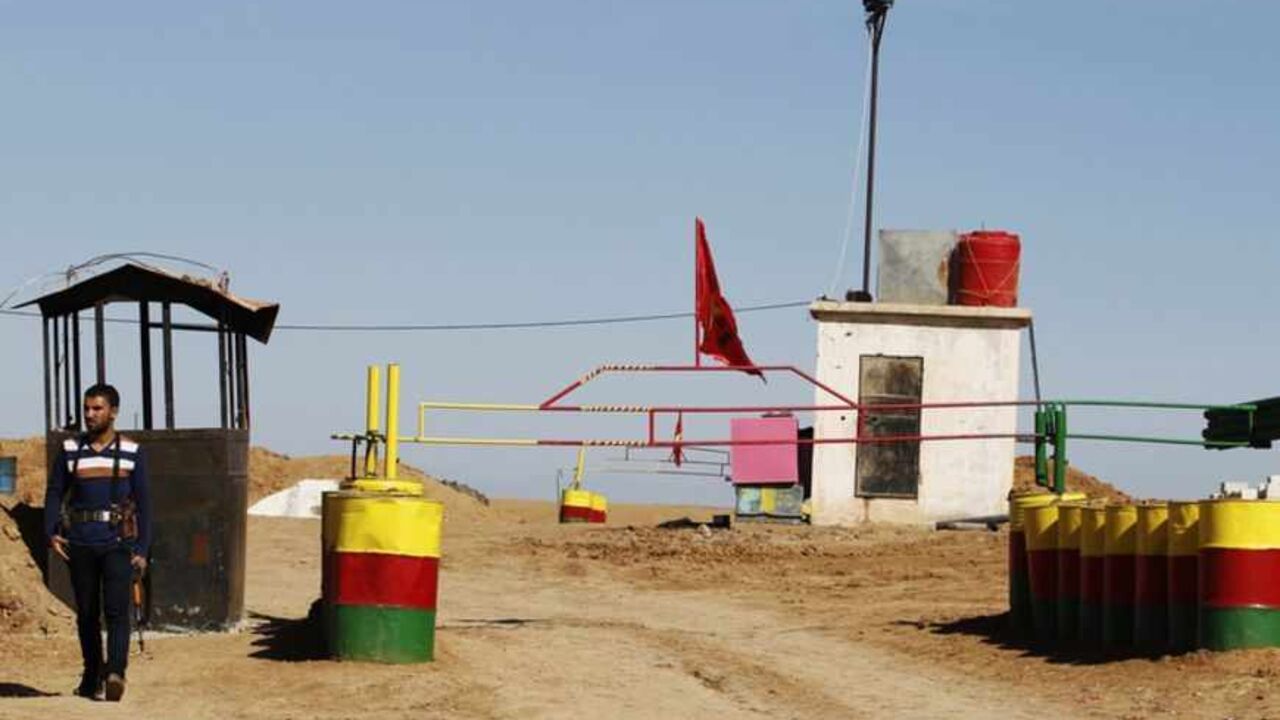 An officer of the Syrian Kurdish Democratic Union Party (PYD) stands guard near the Syrian-Iraq border An officer of the Syrian Kurdish Democratic Union Party (PYD) stands guard near the Syrian-Iraq border October 31, 2012. Iraqi Kurdish President Masoud Barzani warned Kurds in Syria against being sucked into the "fires of discord," urging them to preserve Kurdish unity as tensions between rival factions threaten to spillover into violence. Syria's Kurds see the war ravaging their country as an unprecedented opportunity to gain the kind of freedoms enjoyed by their ethnic kin in neighbouring Iraq, where they