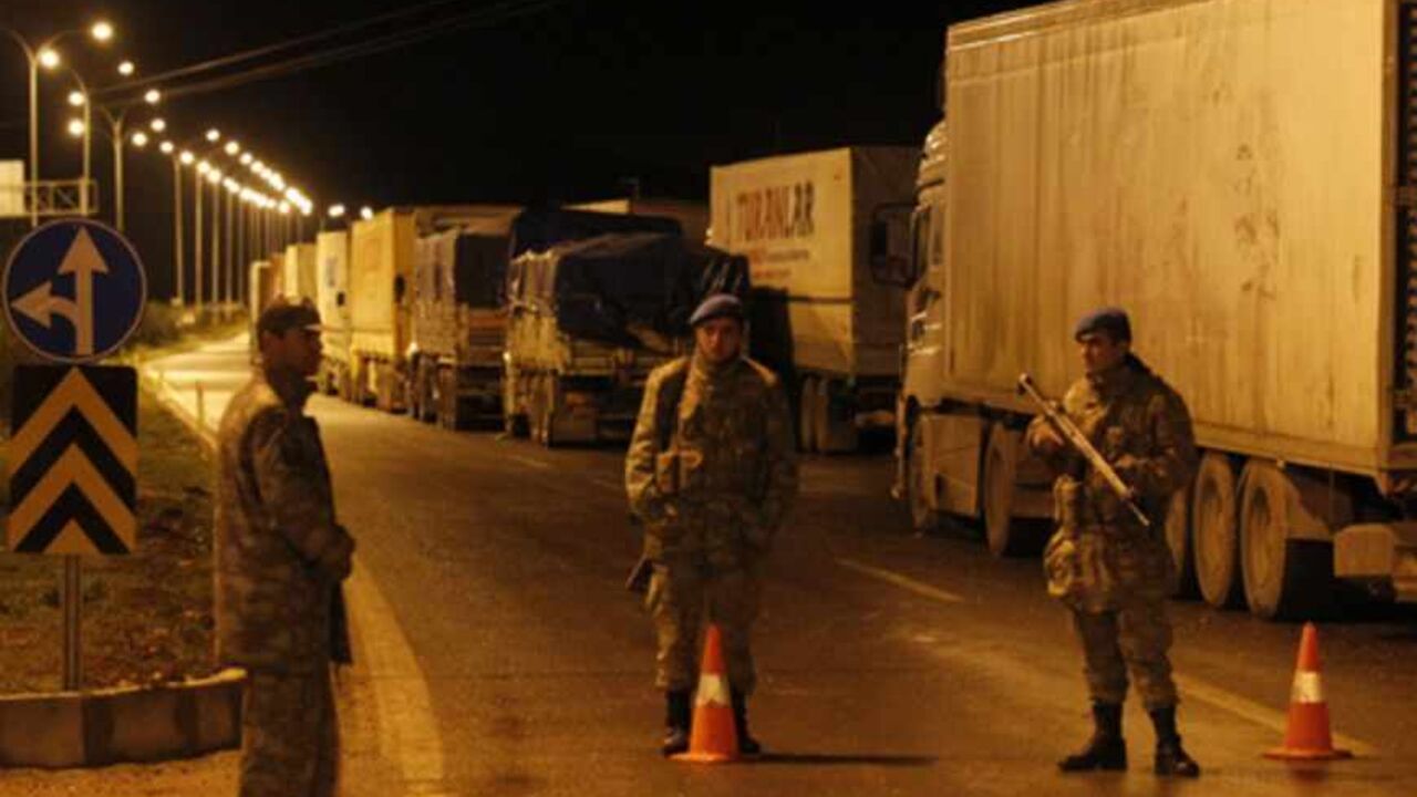 Turkish soldiers block a road to Cilvegozu border gate near the town of Reyhanli on the Turkish-Syrian border in Hatay province Turkish soldiers block a road to Cilvegozu border gate near the town of Reyhanli on the Turkish-Syrian border in Hatay province February 11, 2013. A Syrian minibus exploded at Cilvegozu border post on Turkey's border with Syria near the Turkish town of Reyhanli on Monday, killing at least 13 people including Turkish citizens and wounding dozens more, Turkish officials said. REUTERS/Umit Bektas (TURKEY - Tags: POLITICS CIVIL UNREST DISASTER) - RTR3DNGS