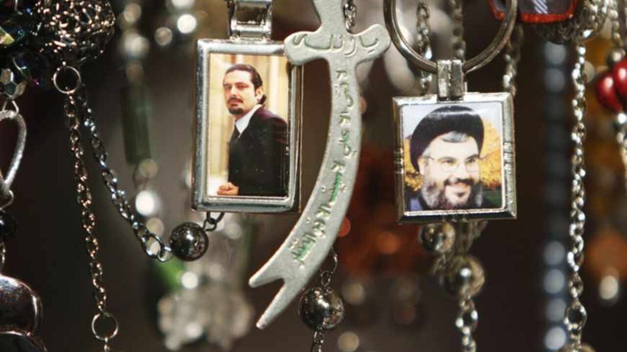 Pictures of Lebanon's Hezbollah leader Nasrallah and Lebanese caretaker Prime Minister al-Hariri are seen on key rings at a gift shop in Sidon Pictures of Lebanon's Hezbollah leader Sayyed Hassan Nasrallah (R) and Lebanese caretaker Prime Minister Saad al-Hariri are seen on key rings at a gift shop in the port city of Sidon, southern Lebanon, January 19, 2011. Saudi Arabia has abandoned its mediation efforts in Lebanon, saying the situation was "dangerous," Al Arabiya television said on Wednesday, citing Foreign Minister Prince Saud al-Faisal. REUTERS/ Ali Hashisho (LEBANON - Tags: POLITICS) - RTXWRZE
