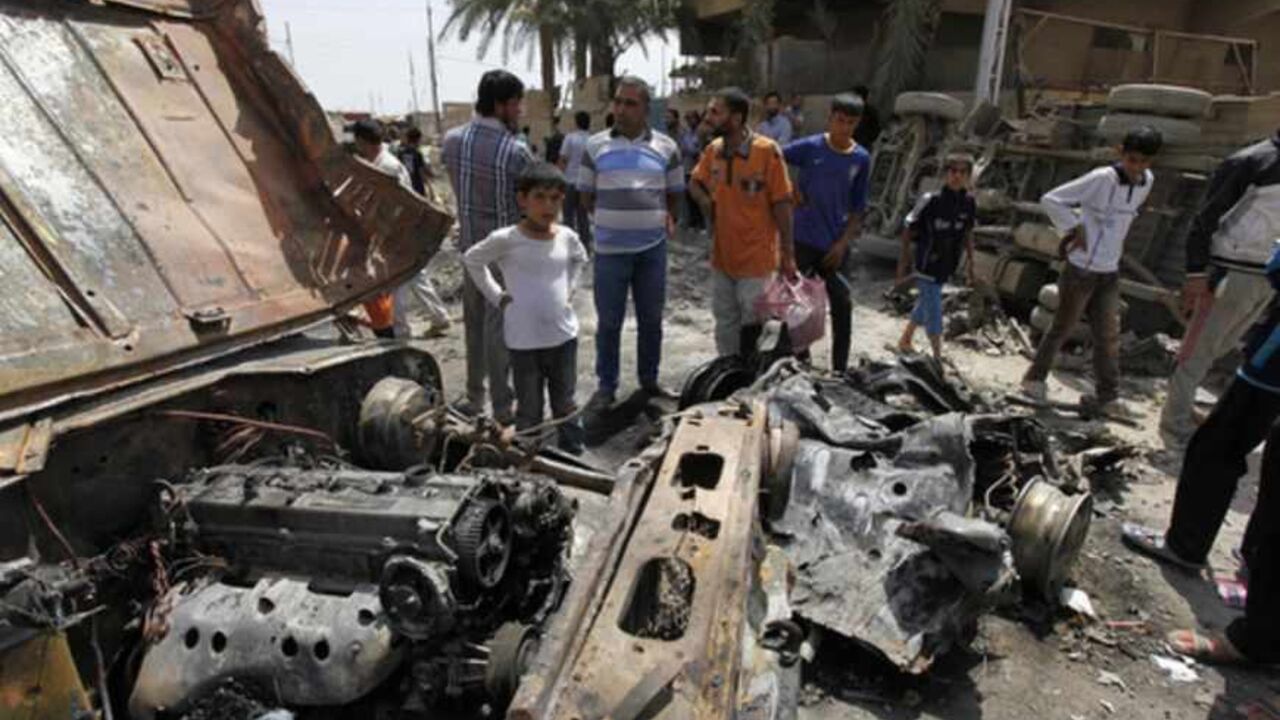 Residents gather at the site of a car bomb attack in the Kamaliya district in Baghdad Residents gather at the site of a car bomb attack in the Kamaliya district in Baghdad April 15, 2013. Car bombs and attacks on cities across Iraq, including two blasts at a checkpoint at Baghdad international airport, killed at least 20 people and wounded more than 200 on Monday, police said. The wave of attacks in Baghdad, Kirkuk, Tuz Khurmato and other towns to the north to south, came days before Iraqis vote in provincial elections that will test political stability more than a year after U.S. troops lef