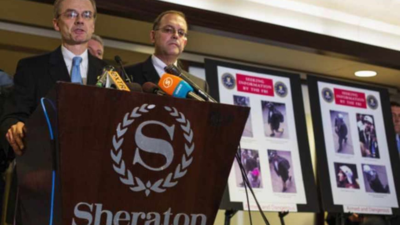 Special Agent in Charge of the FBI's Boston Field Office DesLauriers speaks as he releases images of suspects in the two explosions during the Boston Marathon, at a news conference in Boston Special Agent in Charge of the FBI's Boston Field Office Richard DesLauriers (L) speaks as he releases images of suspects in the two explosions during the Boston Marathon, at a news conference in Boston, Massachusetts, April 18, 2013. The FBI said on Thursday that it has identified two suspects in the Boston Marathon bombing and is asking the public for help in identifying the two men. REUTERS/Lucas Jackson (UNITED STATES - Tags: SPORT ATHLETICS CIVIL UNREST CRIME LAW) - RTXYRAS