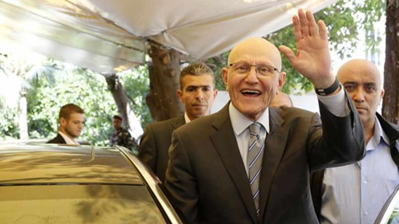 LEBANON-GOVERNMENT/ Lebanese former minister Tammam Salam gestures to his supporters in front of his house while going to the presidential palace in Baabda, Beirut April 6, 2013. Shi'ite militant group Hezbollah, its allies and pro-Western rivals on Friday backed Sunni politician Tammam Salam to be Lebanon's new prime minister, handing him an overwhelming parliamentary endorsement to form a government. REUTERS/Mohamed Azakir (LEBANON - Tags: POLITICS) - RTXYAJC