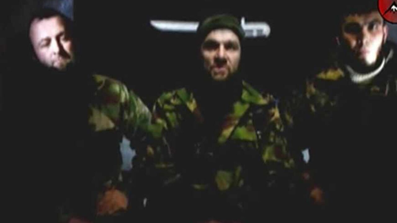 RUSSIA-CAUCASUS/`` An undated still image taken from video shows the address of Chechen rebels, led by Emir of the Caucasus Doku Umarov (C). Chechen rebel leader Umarov has said his forces will carry out more attacks and that Russia faces a year of "blood and tears" if it refuses to abandon its North Caucasus territories, according to a story on February 5, 2011. REUTERS/www.kavkazcenter.com/Reuters TV (RUSSIA - Tags: CRIME LAW POLITICS CIVIL UNREST) - RTXXHY0