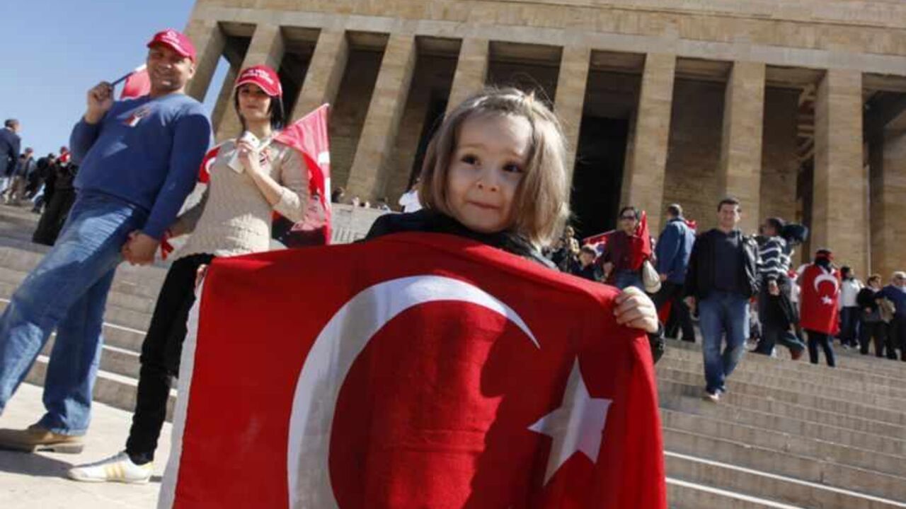 A girl holds a Turkish national flag as she visits the mausoleum of Ataturk, founder of modern Turkey, in Ankara A girl holds a Turkish national flag as she visits the mausoleum of Mustafa Kemal Ataturk, founder of modern Turkey, during a ceremony to mark National Sovereignty and Child's Day in Ankara April 23, 2013. REUTERS/Umit Bektas (TURKEY - Tags: POLITICS) - RTXYWM1