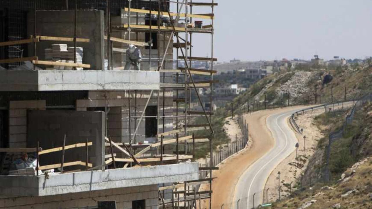 A labourer works on a construction site in a Jewish settlement near Jerusalem A labourer works on a construction site in a Jewish settlement near Jerusalem known to Israelis as Har Homa and to Palestinians as Jabal Abu Ghneim May 7, 2013. Prime Minister Benjamin Netanyahu has quietly curbed new building projects in Jewish settlements, an Israeli watchdog group and media reports said on Tuesday, in an apparent bid to help U.S. efforts to revive peace talks with the Palestinians. REUTERS/Ronen Zvulun (POLITICS BUSINESS CONSTRUCTION) - RTXZDI4