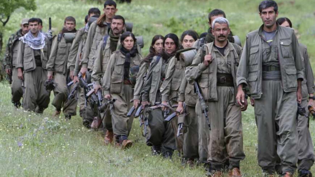 Kurdistan Workers Party (PKK) fighters walk on the way to their new base in northern Iraq Kurdistan Workers Party (PKK) fighters walk on the way to their new base in northern Iraq May 14, 2013. The first group of Kurdish militants to withdraw from Turkey under a peace process entered northern Iraq on Tuesday, and were greeted by comrades from the Kurdistan Workers Party (PKK), in a symbolic step towards ending a three-decades-old insurgency. The 13 men and women, carrying guns and with rucksacks on their backs, arrived in the area of Heror, near Metina mountain on the Turkish-Iraqi border, a Reu