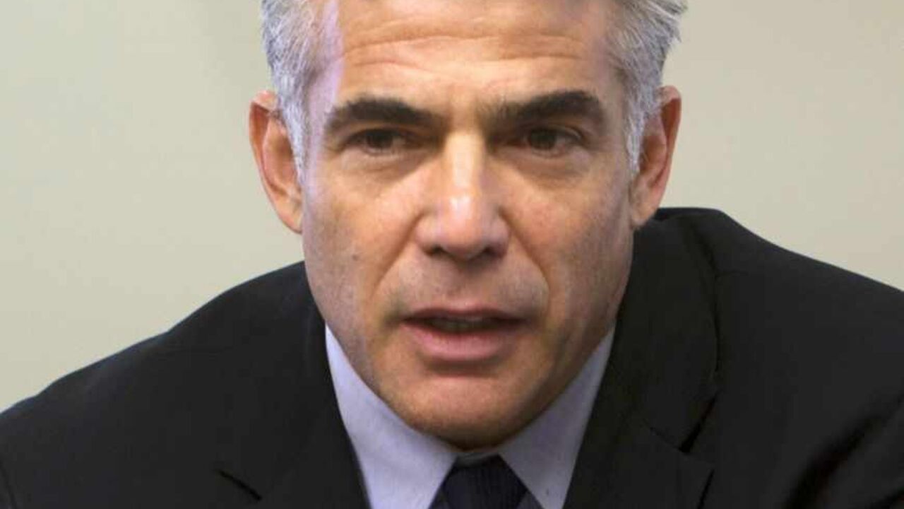 Israel's Finance Minister Lapid attends a Yesh Atid party meeting at the Israeli parliament in Jerusalem Israel's Finance Minister Yair Lapid attends a Yesh Atid party meeting at the Knesset, the Israeli parliament, in Jerusalem May 20, 2013. Lapid, whose new centrist party is the second largest in Israel's government, said on Monday thousands of Jewish settlers would have to be removed from occupied land under any peace deal with the Palestinians. REUTERS/Ronen Zvulun (JERUSALEM - Tags: POLITICS HEADSHOT) - RTXZTWT