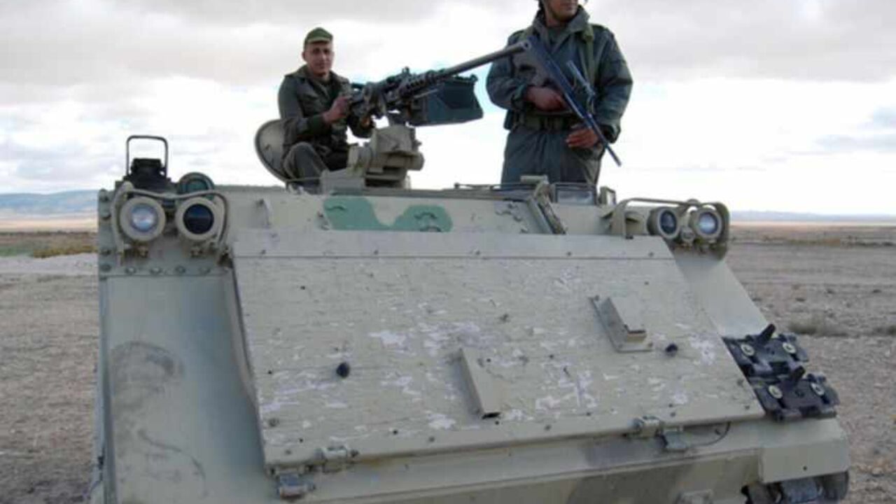 TUNISIA-ALGERIA-UNREST Tunisian soldiers stand on their tank as they take part in a search operation for gunmen in Dernaya Mountains in the Kasserine region, near the Algerian border, on December 11, 2012. Tunisian security forces have mounted a search operation for gunmen who carried out an attack in the Kasserine region, killing a policeman, a security source said. AFP PHOTO / ABDERRAZEK KHLIFI (Photo credit should read ABDERRAZEK KHLIFI/AFP/Getty Images)