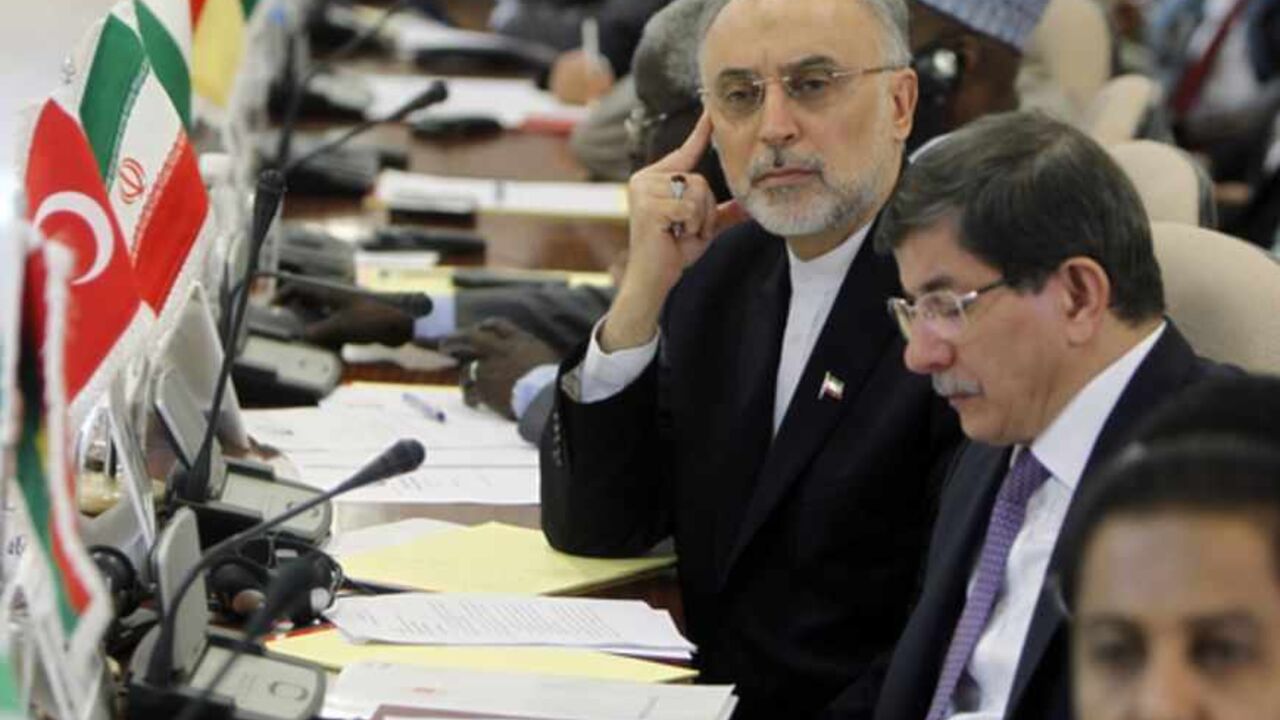 SAUDI-OIC-MALI-POLITICS Iranian Foreign Minister Ali Akbar Salehi (L) looks past his Turkish counterpart Ahmet Davutoglu (2nd R) during the opening of a ministerial meeting in the Saudi Red Sea city of Jeddah, by the Organisation of Islamic Cooperation (OIC) on May 13, 2013. The OIC urged its member states to make generous contributions at this week's main donors conference on Mali to be held in Brussels, which aims to raise funds to repair the damage caused by the war against Islamists in the African country. AFP PHOTO/STR