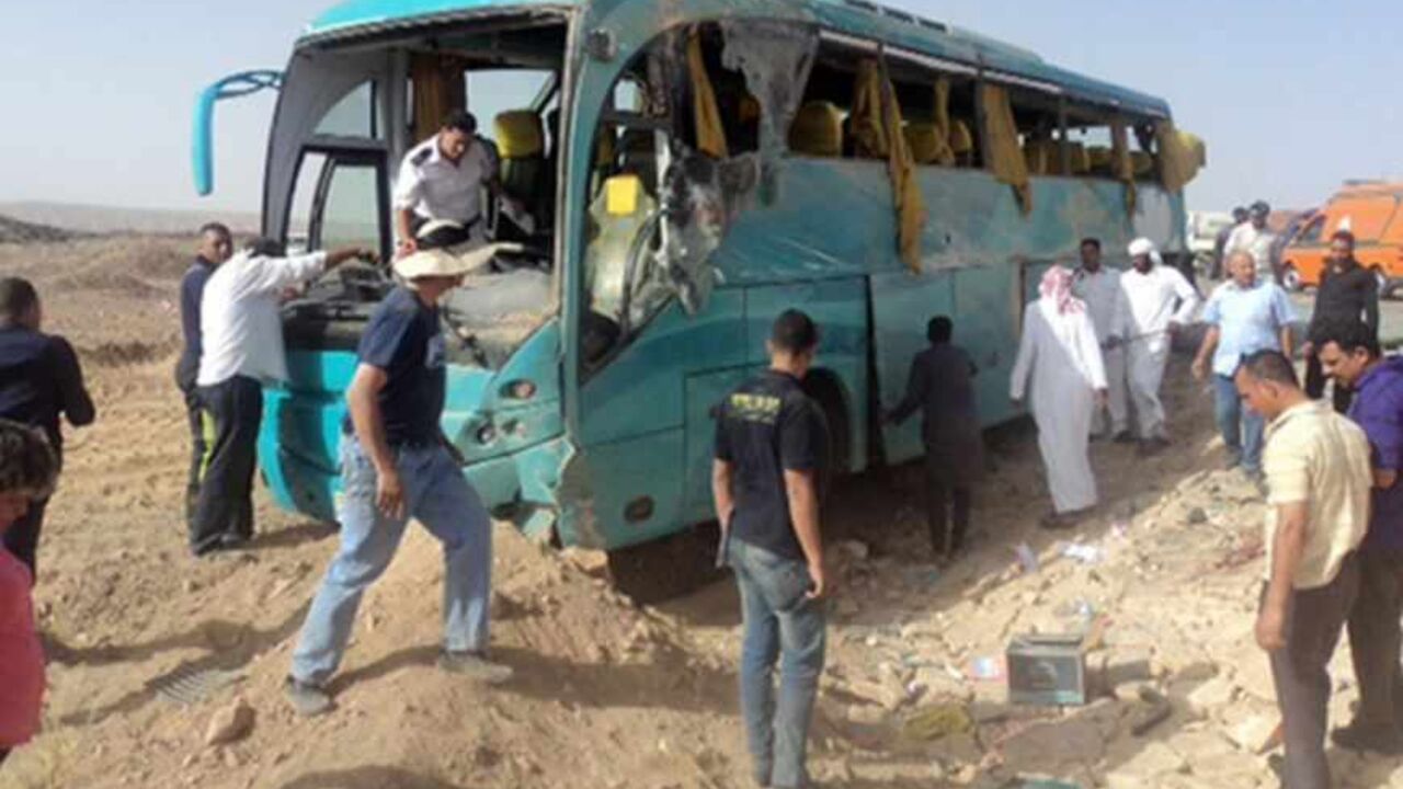 EGYPT-MEXICO-TOURISM-ACCIDENT Egyptian security forces and emergency personnel inspect the bus at the site of a road accident in Egypt's Sinai Peninsula on May 31, 2013 which left four Mexican tourists killed. Seventeen tourists, all Mexican, were injured in the crash, South Sinai's governor told AFP, adding that two were in critical condition. AFP PHOTO/STR (Photo credit should read -/AFP/Getty Images)