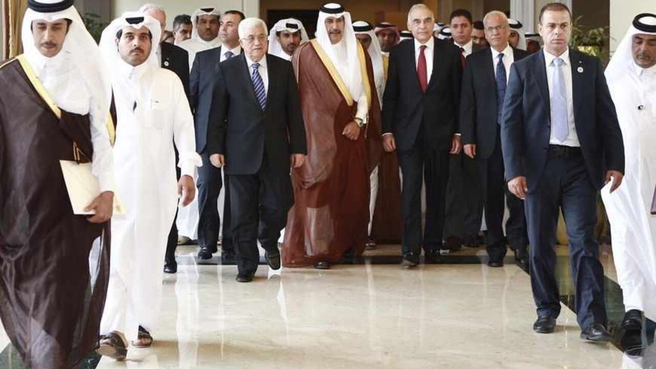 QATAR/ Palestinian President Mahmoud Abbas (centre L), Qatari Prime Minister and Foreign Minister Hamad bin Jassim al-Thani (C) and Egyptian Foreign Minister Mohamed Kamel Amr (centre R) arrive to the Arab Peace Initiative Committee Meeting in Doha December 9, 2012. REUTERS/Mohammed Dabbous (QATAR - Tags: POLITICS) - RTR3BDR2