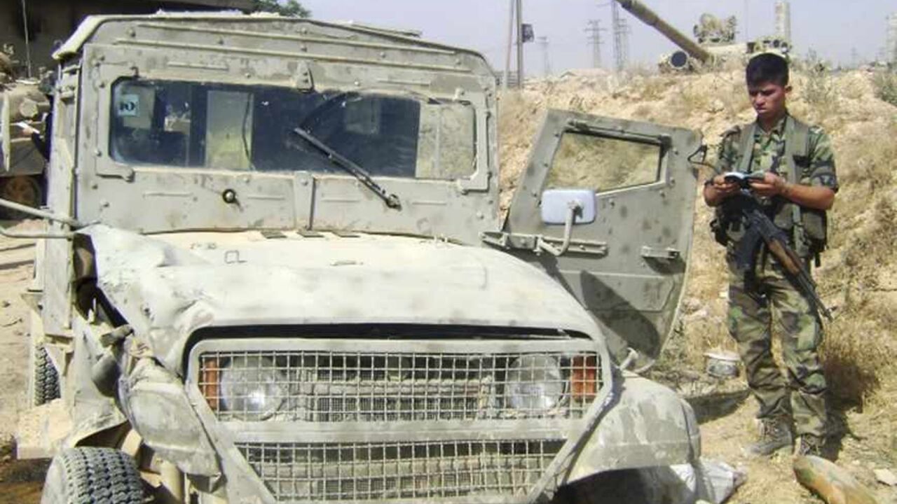 SYRIA-ISRAELI VEHICLE/ A handout photograph distributed by Syria's national news agency SANA, on May 20,2013, shows a vehicle which it says is an Israeli military vehicle being used by rebel fighters in Qusair near Homs city. Syrian television also showed footage of what it said was an Israeli military Jeep which it said the rebels had been using and which showed the extent of their foreign backing. An Israeli military spokeswoman said the vehicle was decommissioned a decade ago and dismissed the footage as "poor propaganda". SAN