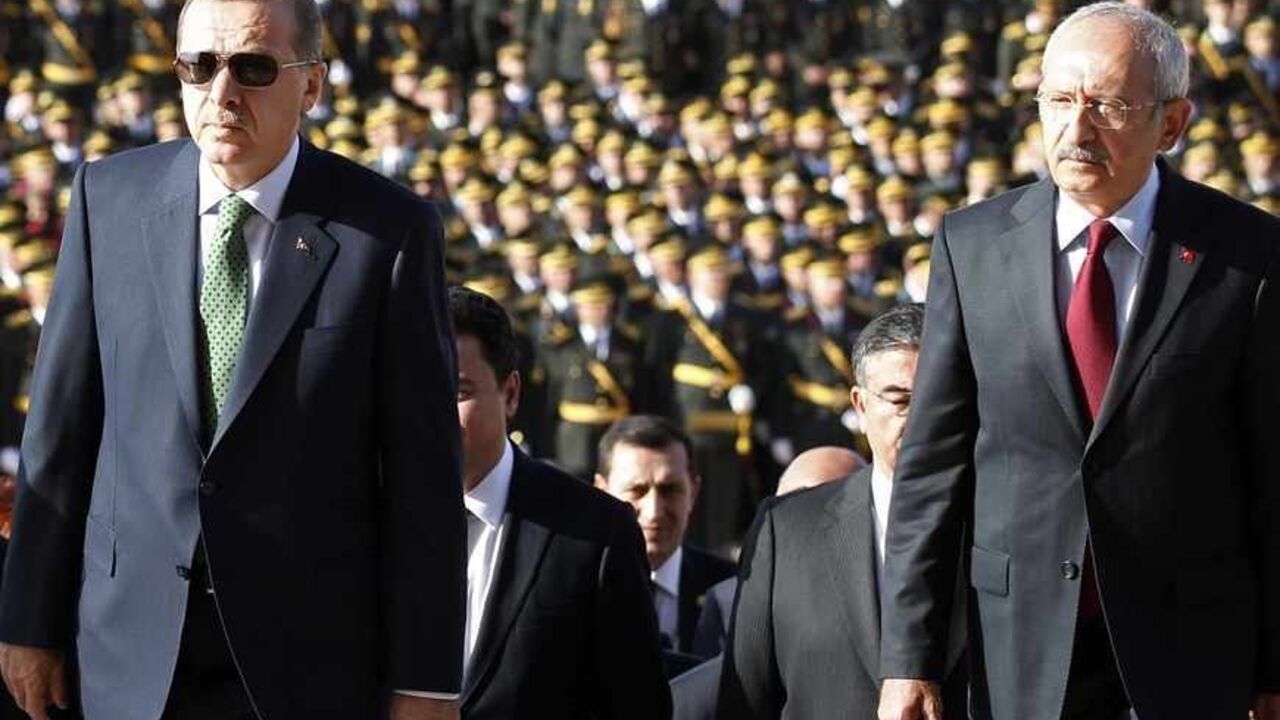TURKEY Turkey's Prime Minister Tayyip Erdogan (2nd R) and leader of the main opposition Republican People's Party (CHP) Kemal Kilicdaroglu (R) attend an official ceremony to mark the 89th anniversary of Republic Day at Anitkabir in Ankara October 29, 2012. Anitkabir is the mausoleum of Mustafa Kemal Ataturk, founder of secular Turkey. REUTERS/Umit Bektas (TURKEY - Tags: POLITICS) - RTR39QHB