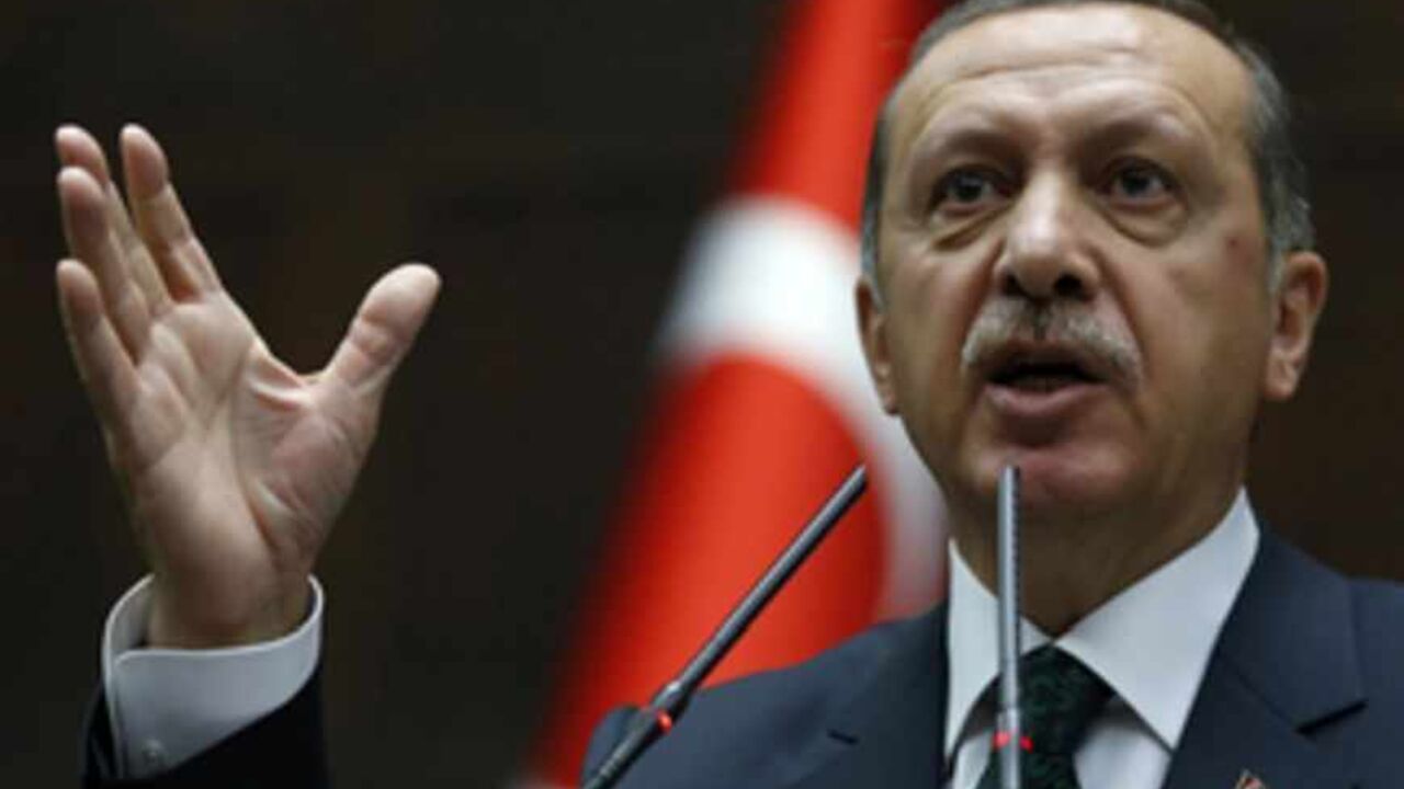 TURKEY-PROTESTS/ Turkey's Prime Minister Tayyip Erdogan addresses members of parliament from his ruling AK Party (AKP) during a meeting at the Turkish parliament in Ankara June 25, 2013. Turkish anti-terrorism police detained 20 people in raids in the capital Ankara on Tuesday in connection with weeks of anti-government protests across the country, media reports said. The unrest began at the end of May when police used force against campaigners opposed to plans to redevelop a central Istanbul park. The protest spiralled int