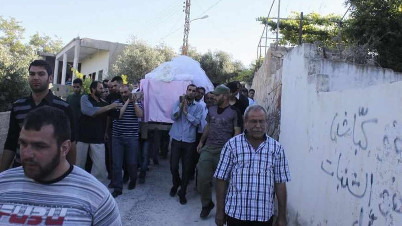 SYRIA-CRISIS/LEBANON SOLDIERS ATTENTION EDITORS - VISUAL COVERAGE OF SCENES OF INJURY OR DEATH
Relatives of Lulu Abdallah Awad carry her coffin during her funeral in Shi'ite town of Hermel, about 30 km (20 miles) north of Arsal May 28, 2013. Several rockets have been fired into Hermel in the past 24 hours. One of them killed Lulu and wounded two people, the Lebanese army said. REUTERS/Rami Bleibel (LEBANON - Tags: POLITICS CIVIL UNREST) TEMPLATE OUT - RTX1048Y