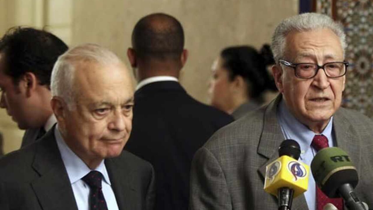 EGYPT/ Arab League Secretary-General Nabil Elaraby (L) listens to U.N.-Arab League envoy for Syria Lakhdar Brahimi speak during a news conference at the Arab League headquarters in Cairo March 18, 2013. REUTERS/Stringer (EGYPT - Tags: POLITICS) - RTR3F5HL