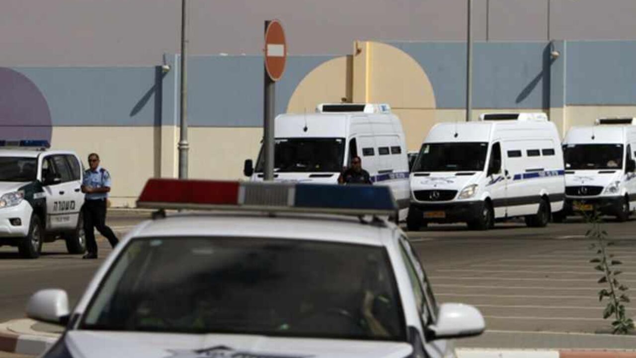 A convoy of Israeli Prison Authority vehicles leaves Ela prison in Beersheba A convoy of Israeli Prison Authority vehicles leaves Ela prison in the southern city of Beersheba, as they transport Egyptian prisoners due to be released through the border crossing next to the Egyptian Red Sea resort of Taba, October 27, 2011. Egyptians gathered at the border with Israel on Thursday awaiting the handover of prisoners to be exchanged for an American-Israeli man held by Egypt and accused of spying. REUTERS/Amir Cohen (ISRAEL - Tags: POLITICS CRIME LAW) - RTR2T9EU