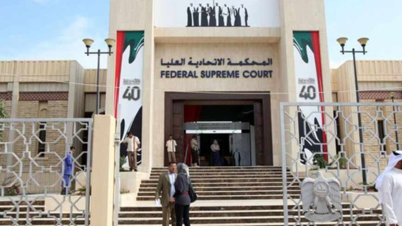People stand outside the federal supreme court, where the verdict for five political activists was read out, in Abu Dhabi People stand outside the federal supreme court, where the verdict for five political activists was read out, in Abu Dhabi November 27, 2011. The activists convicted on Sunday of insulting the leaders of the United Arab Emirates were sentenced to between two and three years in jail. REUTERS/Nikhil Monteiro (UNITED ARAB EMIRATES - Tags: CRIME LAW POLITICS CIVIL UNREST) - RTR2UJ0C