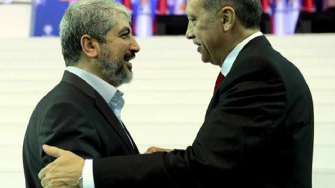 Turkey's Prime Minister and leader of ruling Justice and Development Party Erdogan welcomes his guest Hamas leader Meshaal during the AKP congress in Ankara Turkey's Prime Minister and leader of ruling Justice and Development Party (AKP) Tayyip Erdogan (R) welcomes his guest Hamas leader Khaled Meshaal during the AKP congress in Ankara September 30, 2012. Erdogan trumpeted Turkey's credentials as a rising democratic power on Sunday, saying his Islamist-rooted ruling party had become an example to the Muslim world after a decade in charge. Addressing thousands of party members and regional leaders at a congress of his Justice and Development (AK) Party, Erdogan