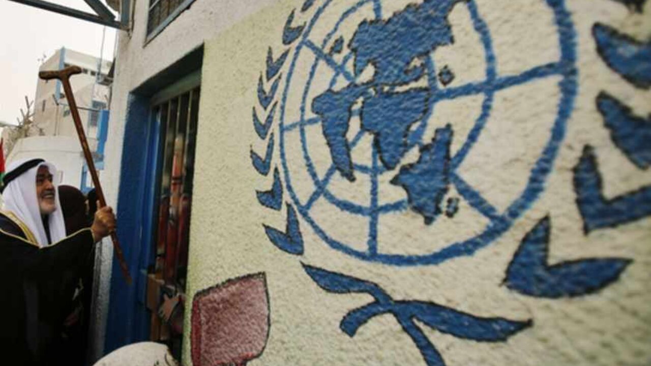 A Palestinian refugee knocks on the closed gate of the UNRWA headquarters with his walking stick during a protest in Gaza City A Palestinian refugee knocks on the closed gate of the United Nations Relief and Works Agency (UNRWA) headquarters with his walking stick, during a protest demanding UNRWA to resume aid for refugees in Gaza City April 8, 2013. The main U.N. humanitarian agency for Palestinians closed all of its relief and distribution centres in Gaza after protesters stormed its headquarters on Thursday demanding it to reverse a decision to cut annual cash handouts of $40 for the poorest beneficiaries. REUTERS/Suhaib Salem