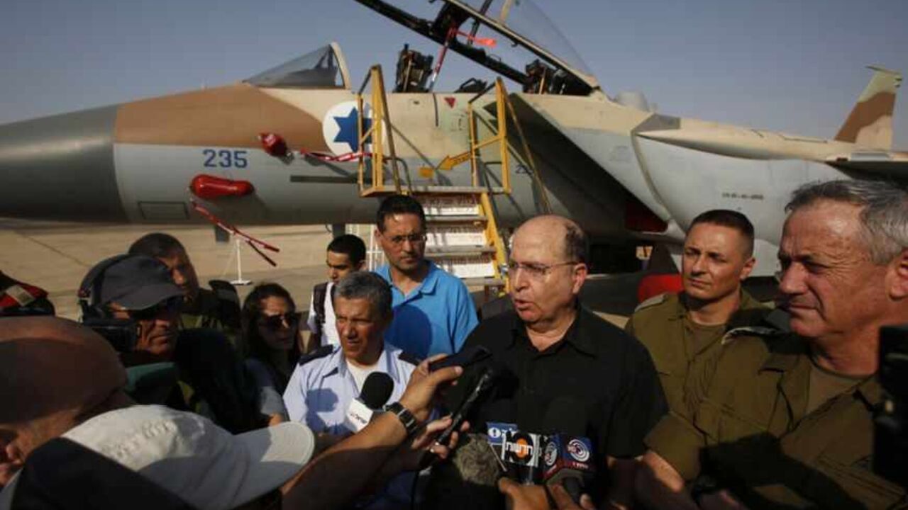 An Israeli Air Force F-15I jet is seen in the background as Israeli Defense Minister Yaalon speaks to reporters at an air base in southern Israel An Israeli Air Force F-15I jet is seen in the background as Israeli Defense Minister Moshe Yaalon (3rd R) speaks to reporters while standing next to Israel's armed forces chief Major-General Benny Gantz (R) and commander of Israel's Air Force Major-General Amir Eshel (4th R) during a presentation at Hatzerim air base in southern Israel April 30, 2013. Israel on Tuesday launched its first targeted attack on a militant in Gaza since a war in November, killing a Palestinian jihadist in an air strike that put f