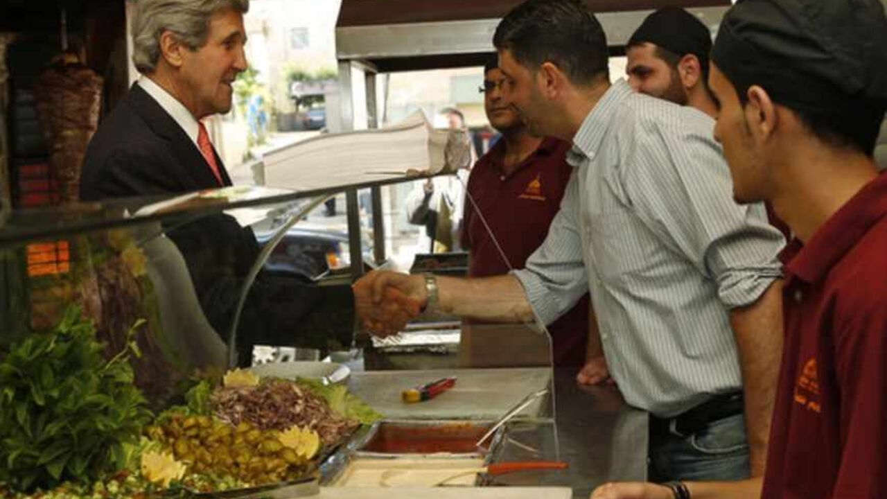 U.S. Secretary of State John Kerry greets workers as he visits a restaurant in the West Bank city of Ramallah U.S. Secretary of State John Kerry greets workers as he visits a restaurant in the West Bank city of Ramallah, May 23, 2013. REUTERS/Jim Young (WEST BANK - Tags: POLITICS) - RTXZXXP