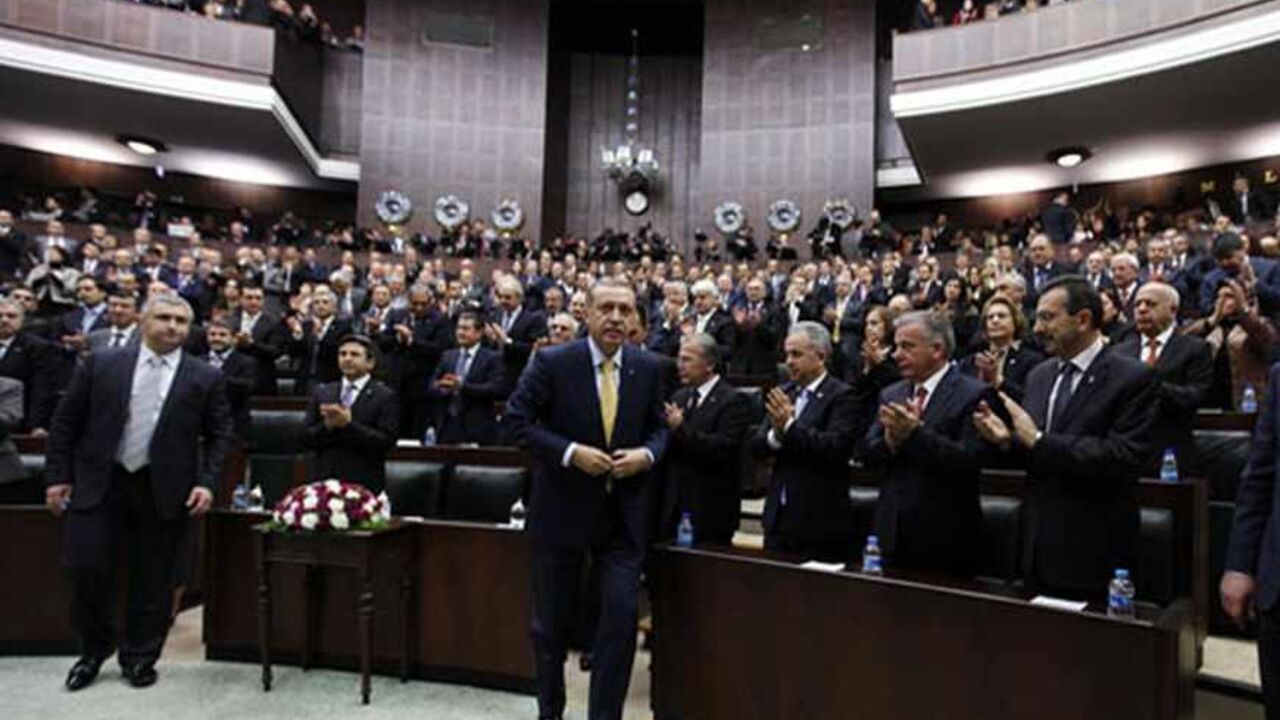 TURKEY-ERDOGAN/ Turkey's Prime Minister Tayyip Erdogan leaves his seat to address members of parliament from the ruling AK Party (AKP) during a meeting at the Turkish parliament in Ankara February 19, 2013. REUTERS/Umit Bektas (TURKEY - Tags: POLITICS) - RTR3DZE4