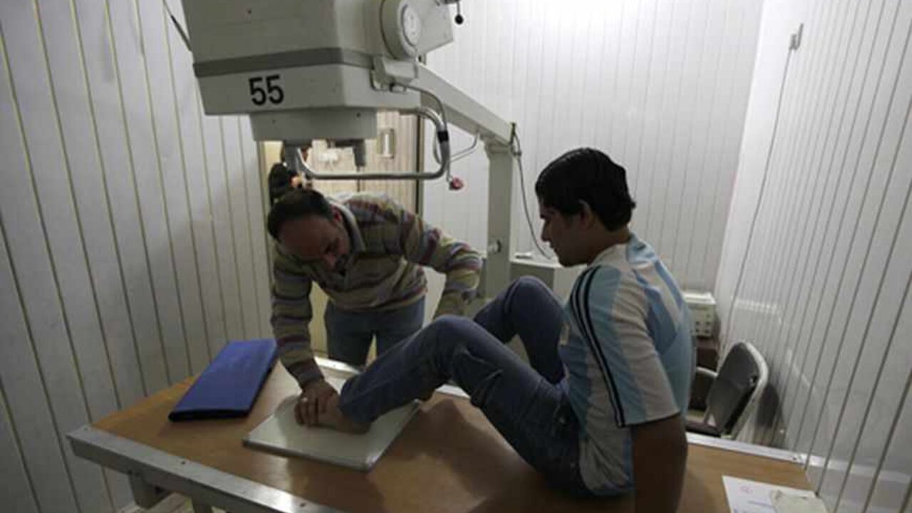 IRAQ-ECONOMY/BUSINESS A physical therapist treats a patient at a medical clinic in Baghdad March 8, 2011. Development in Iraq has been stifled by decades of economic sanctions and war and SMEs, often seen as the backbone of a country's economy, have made little progress in Iraq due to high start-up costs and scant government funding. Chronic power and water shortages, ongoing security concerns and high customs tariffs have all made it difficult for a small business sector to emerge. Picture taken March 8, 2011. To match fe